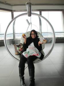 The wonderful, vibrant Ruchika at the top of The Žižkov Television Tower having a snack in Prague, Czech Republic.